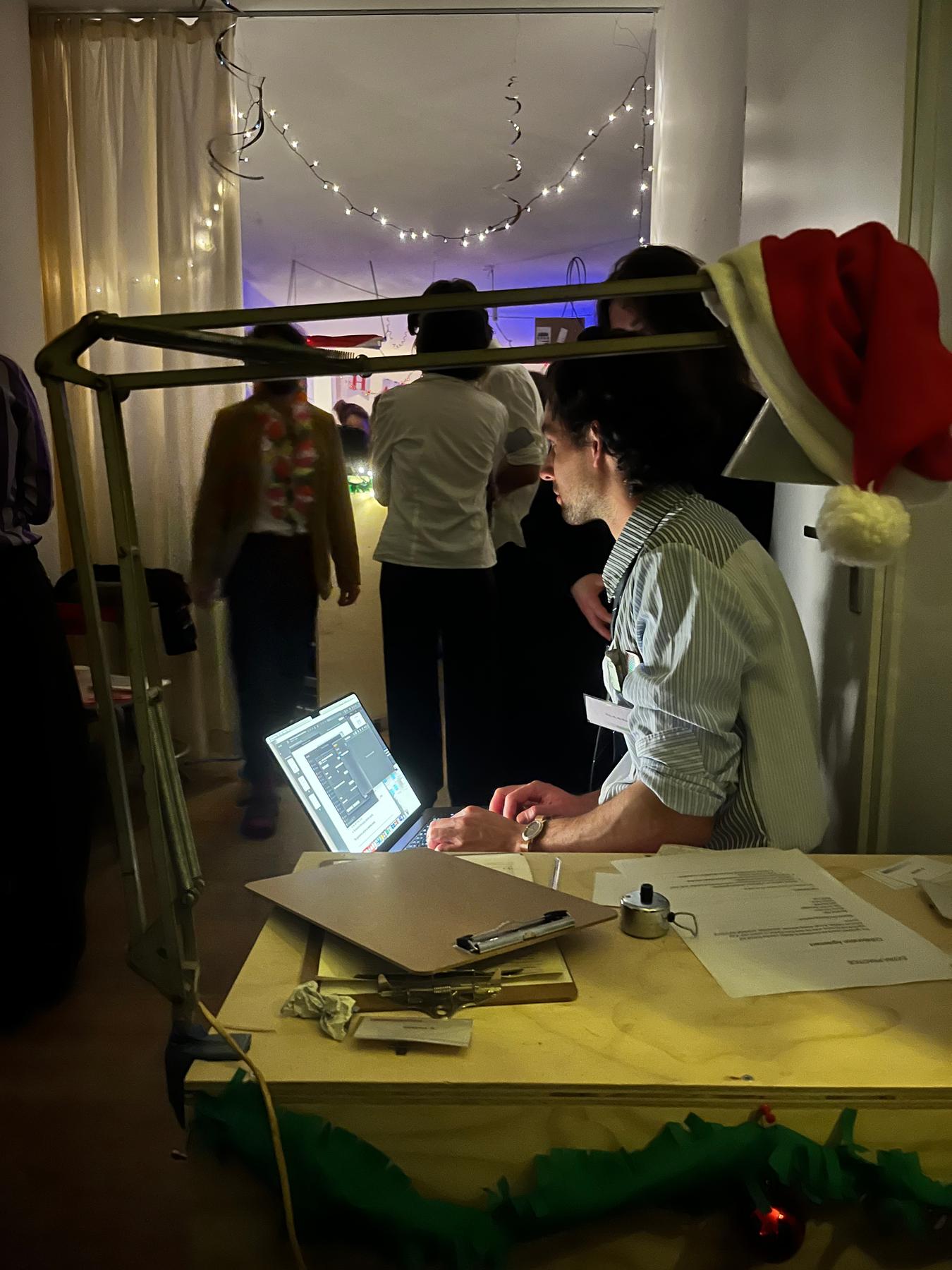 Gijs working during the office christmas party