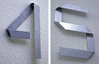 House numbers from single strip of metal — Jack Curry