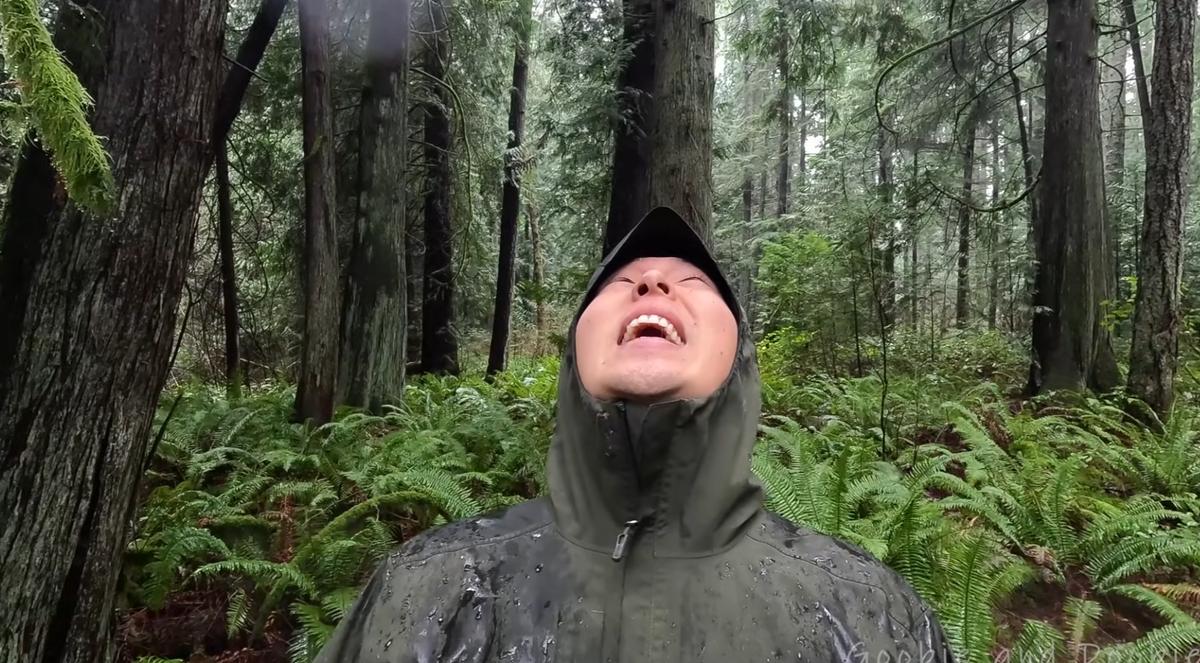 man smiling in rain