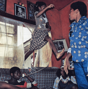 a-fan-jumps-through-the-window-of-fela-kuti-s-home-in-nigeria-1979-photographed-by-bruno-barbey.jpg