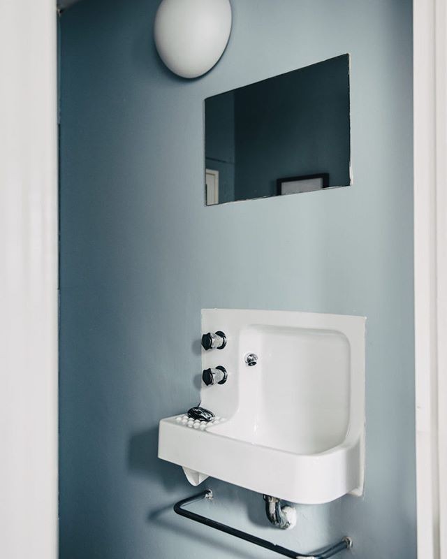 One of the original Barbican sinks and porthole light fixtures. Did you