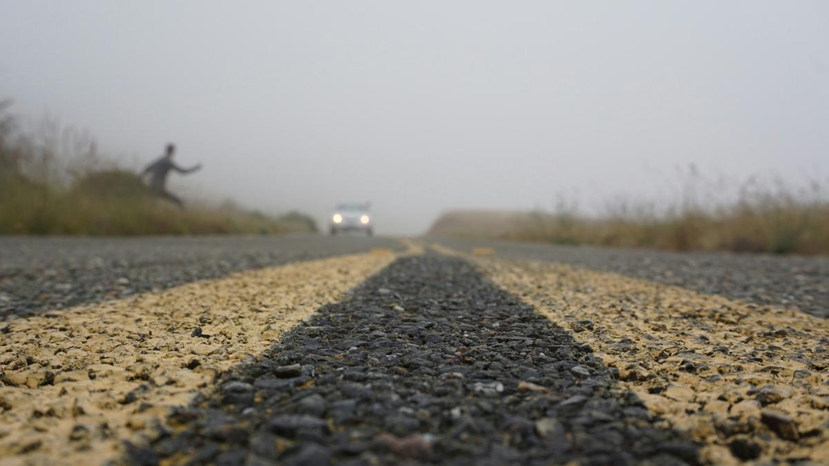 2015-10-06_man-standing-beside-freeway-road-jghaiaoogta.jpg