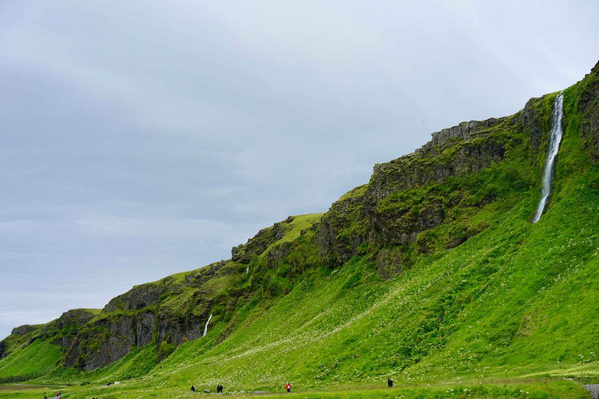 2022-07-26_a-waterfall-on-a-grassy-hill-dflkqgsh69y.jpg
