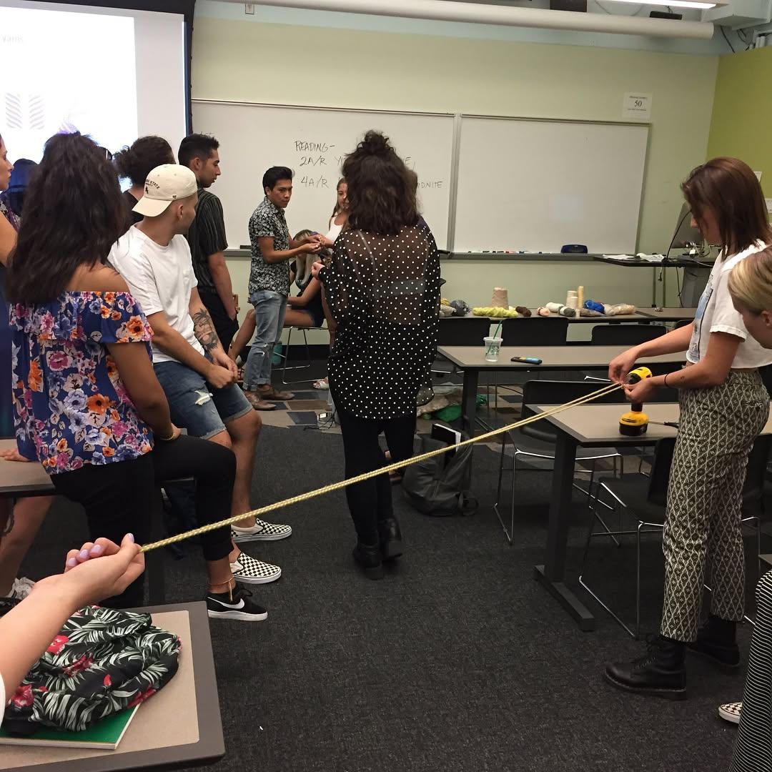 today was the first asu game and i also snuck into a textiles class and weaved some yarn or something