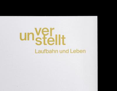 Brand identity with classic helvetica neue typography, restrained green-yellow color accents, and minimal layouts applied to folder and business card.