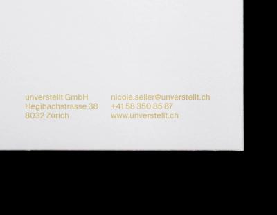 Detail view of a brand identity with modular typography, restrained green-yellow color accents, and minimal layouts applied to folder and business card.