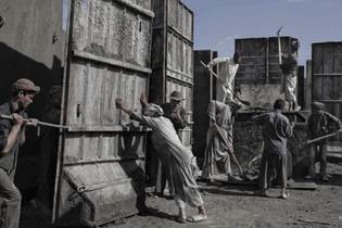"A factory making concrete blast walls," Kabul, 2010. Mauricio Lima.