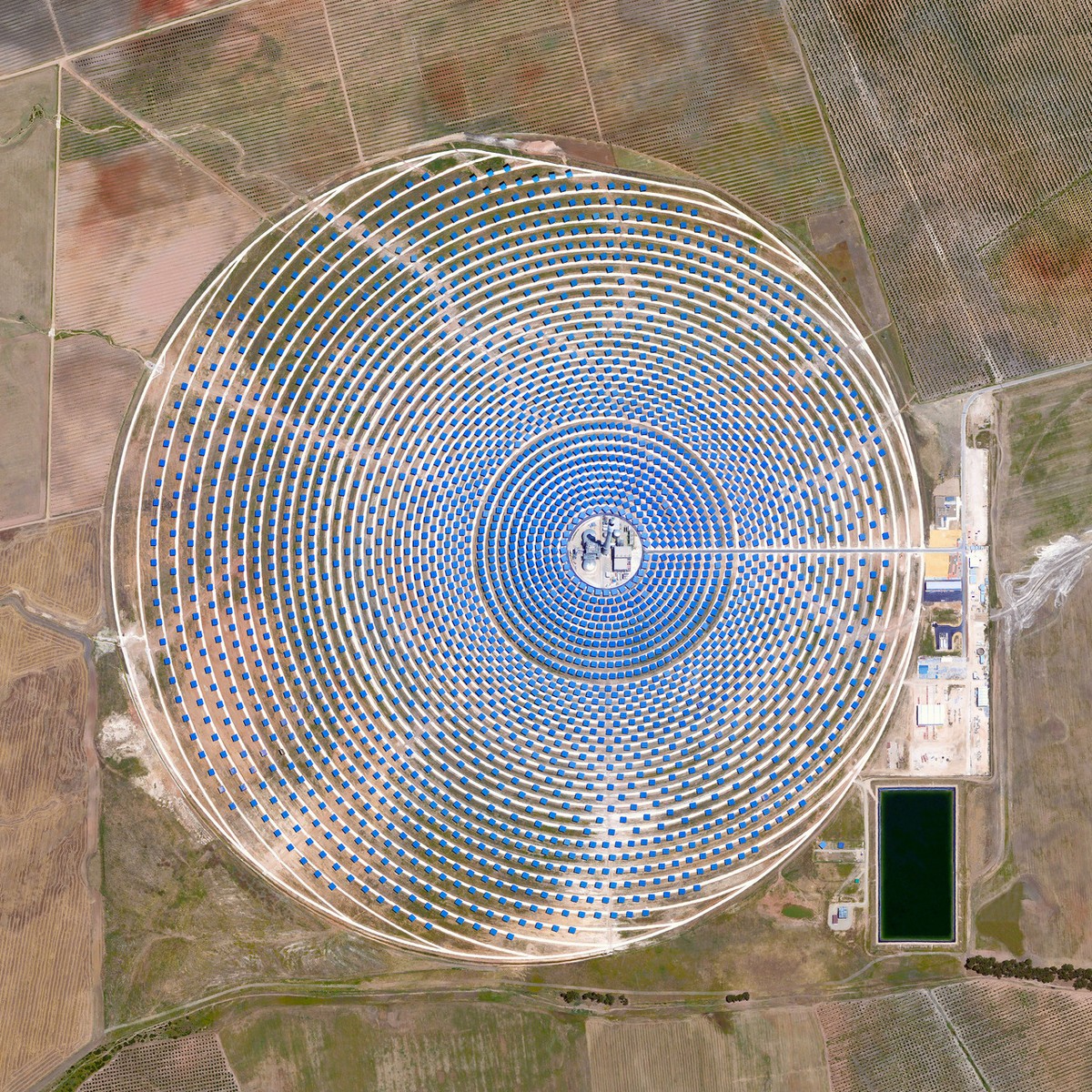 “The Gemasolar Solar Concentrator in Seville, Spain, contains 2,650 heliostat mirrors that focus