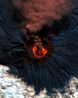 “Lava and ash billow out of Raung, one of the most active volcanoes on the island of Java in Indonesia. Raung towers more than 10,000 feet above sea level and was captured here during a powerful eruption in 2015 with a short-wave infrared satellite camera. The ash produced during this activity forced the closure of numerous airports on the island.”