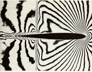 Air flow at high subsonic speed round a wing section in a wind tunnel - a picture taken at one millionth of second. Space encyclopaedia. 1960.