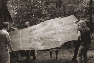workers-carrying-board-historical-sepia.jpg