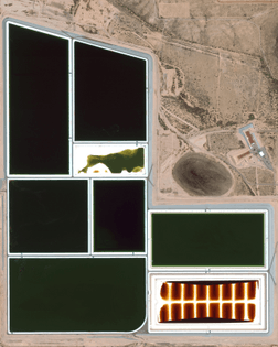 “Waste ponds are seen at Palo Verde Nuclear Generating Station near Tonopah, Arizona. As the most powerful nuclear power plant in the United States, the facility produces an average of 3.3 gigawatts, or enough power to serve roughly 4 million people. Additionally, since it is the only major nuclear power plant that is not located near a large body of water, this facility evaporates water from the treated sewage of several nearby cities to provide cooling for the steam that it produces.”