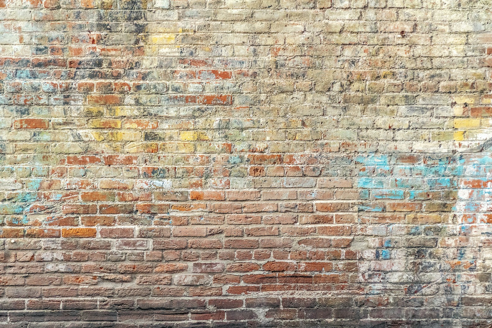 faded-graffiti-on-brick-wall.png