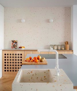 Spotted one of our favorite ways to disguise a radiator in this bright and cheerful kitchen by @babelstudio with terrazzo ev...