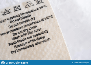 laundry-care-washing-instructions-clothes-label-fabric-texture-background-147586773.jpg