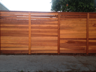 “How These Wooden Fences Became A Symbol Of Gentrification Across Los Angeles”