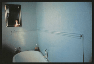 Nan Goldin - Self-Portrait in Blue Bathroom, London (1980)