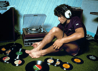Maradona listening to records