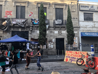 Feminist activists and artists dance outside the Mexican human rights office, which for two months has been run as a shelter for women and children