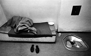 peter-lutkemeyer-sleeping-man-in-prison-cell.jpg