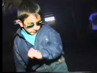 Gypsy kid dancing at club can't be bothered. 1997.