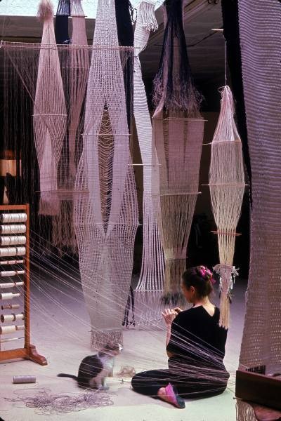 Artist and weaver Lenore Tawney at work on a tapestry, circa 1966.