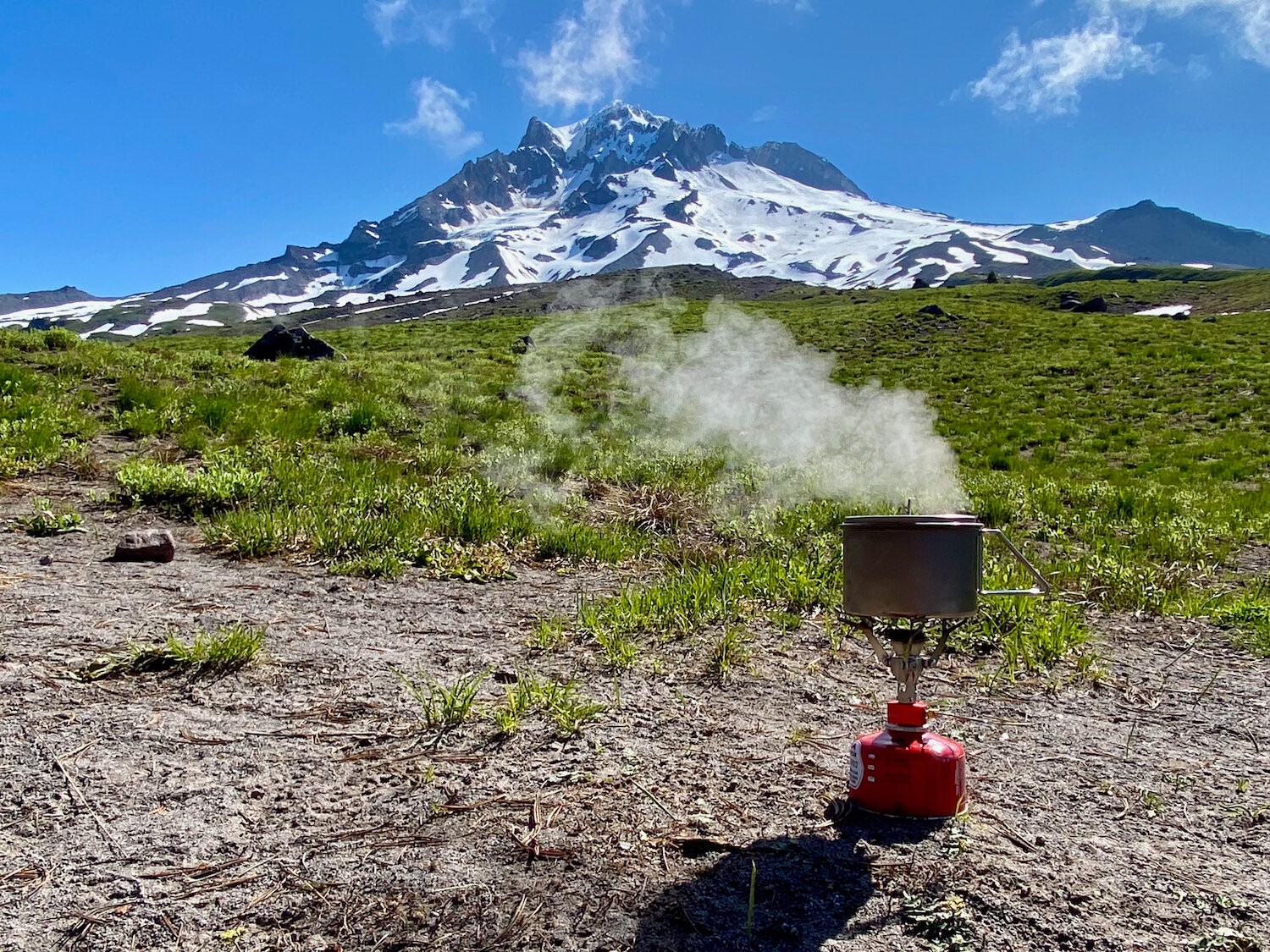 boiling-water-with-the-msr-pocket-rocket-2-in-front-of-a-mountain?format=1500w