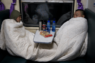 Sleeping slow train travellers, China