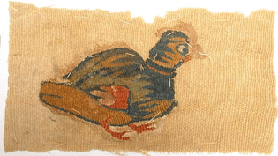 7283. COPTIC TEXTILE. Egypt, Christian Period, c. 4th-6th century AD. Double-weave fabric with partridge. The partridge loosely sewn to a rectangle of plain coptic textile. The rectangle 3 x 6 inches.