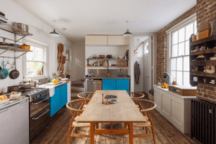 pop of blue exposed brick small kitchen chairs