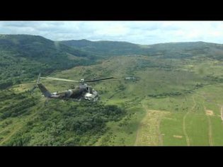 Mi-24 Hind helicopters shoot rockets from pilot view perspective
