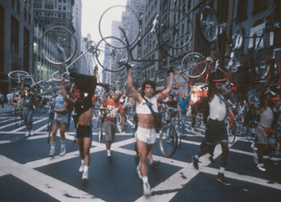 NYC bike messengers, led by Steve Athenios, protest Mayor Koch's Midtown bicycle ban. July 1987.