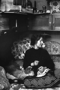 A woman and her pet chicken at home, Paris, 1956. Photographed by Nina Leen.