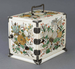 "This intricately crafted shibayama kodansu (small storage chest) was created in the Japanese Meiji period (1868-1912). The delicate floral design is inlaid into ivory."