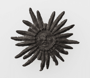 Pilgrim’s Badge with Sun with human face, 15th century, Metropolitan 
