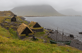An example of a very small museum: A maritime museum located in the village of Bolungarvík, Vestfirðir, Iceland showing a 19th-century fishing base: typical boat of the period and associated industrial buildings.