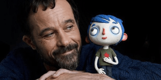 Claude Barras with the protagonist of MY LIFE AS A ZUCCHINI