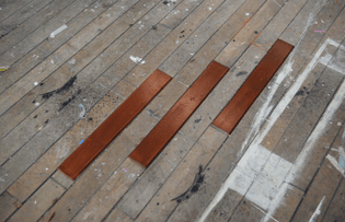 Testing floorboard veneers: 'dark mahogany' with organza interference cut into the surface.