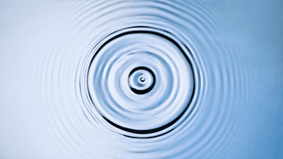 droplet-creating-a-splash-and-ripples-when-hitting-the-surface-picture-id1328838367?b=1-k=20-m=1328838367-s=170667a-w=0-h=9u...