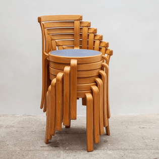Stack of Magnus Olesen 8000 Series Chairs