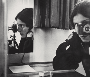 Ilse Bing (German, 1899–1998). Self-Portrait with Leica, 1931. Gelatin silver print. Collection of Michael P. Mattis and Judith Hochberg © Ilse Bing Estate