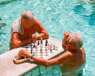 old men playing chess in bathhouses in budapest