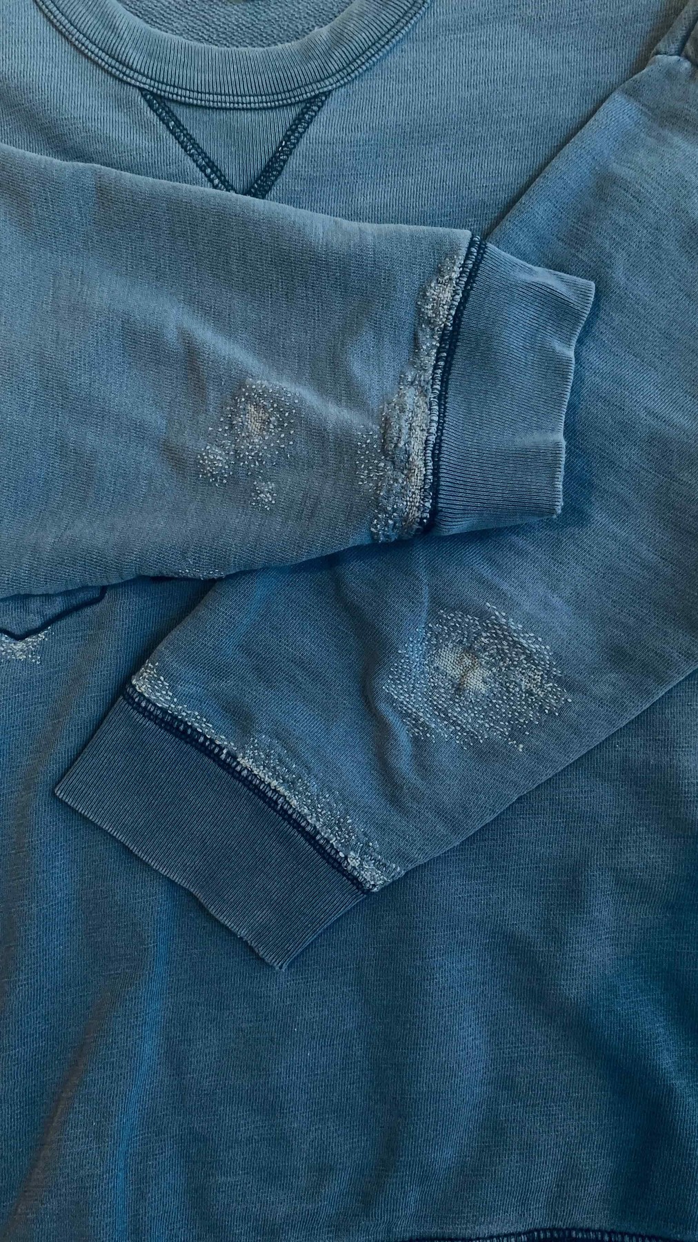 Blue Gap sweatshirt darned with blue threads.
