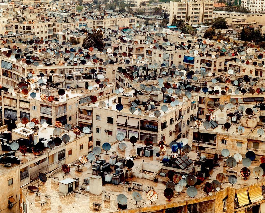 'Satellite Dishes, Aleppo, Syria 2007' by Lottie Davies (@lottiedaviesphoto) is one of the prints available via Prints for Refugees (@printsforrefugees), a non-profit initiative by photographers from all over the world. All proceeds from print sales go directly to Doctors of the World (@dotw_uk), an organization providing healthcare to people displaced by violence, conflict, &amp; natural disaster. Davies traveled to #Syria with her father 10 years ago, before the civil war. "Like so many others, the struggles of the refugees in Calais and those attempting to travel to Europe affected me deeply and I wanted to try to do something about it," photographer Mark Sherratt (@marksherratt) says about launching the project. More at the link in our bio.