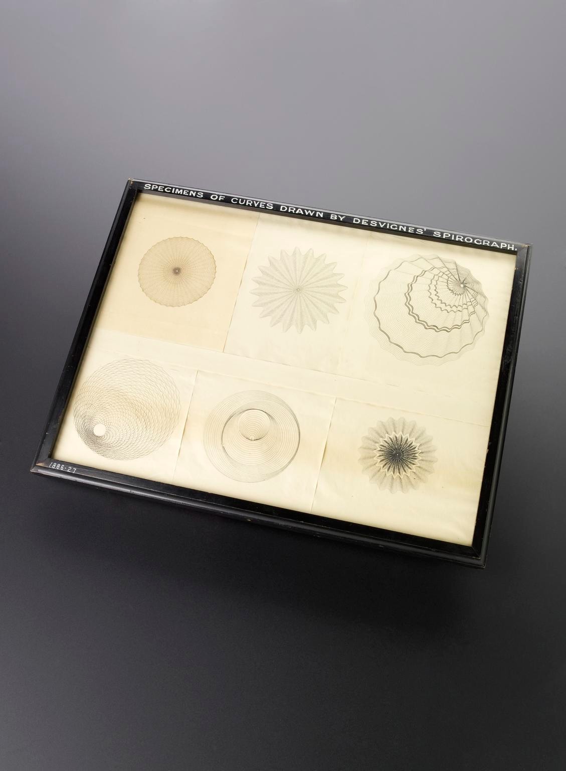 Spirograph and examples of patterns drawn using it MADE: 1886 in Vienna MAKER: Peter Hubert Desvignes 