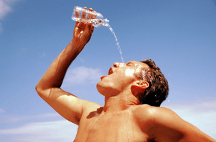 man-pouring-water-his-face.jpg