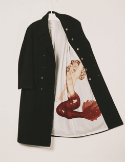 Yohji Yamamoto: wool peacoat with silk screened rayon lining, fall/winter 1991-1992.