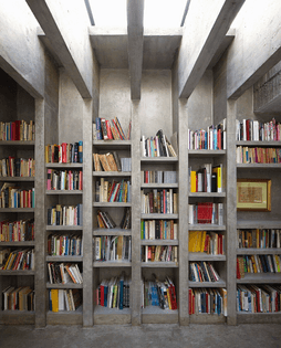 12105571-floor-to-ceiling-concrete-bookcase-with-uprights-continuing-into-ceiling-beams.jpg