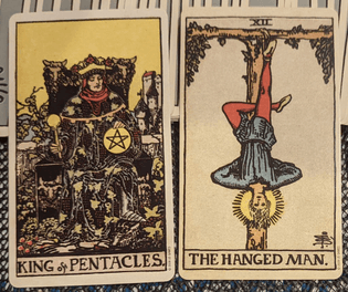 king of pentacles + the hanged man