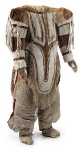 Women's traditional caribou skin outfit with amauti parka, trousers, mitts and long boots with side pouches. The back of the parka has an amaut or pouch for carrying a baby. From Baker Lake, Eskimo Point and Hikoligjuaq, west of Hudson Bay. Collected on 5th Thule Expedition, 1921–1924